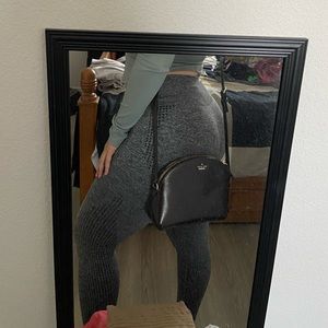 Blackish/brownish Kate Spade dome crossbody bag